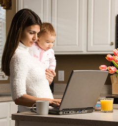 mother and sick child viewing pediatric website